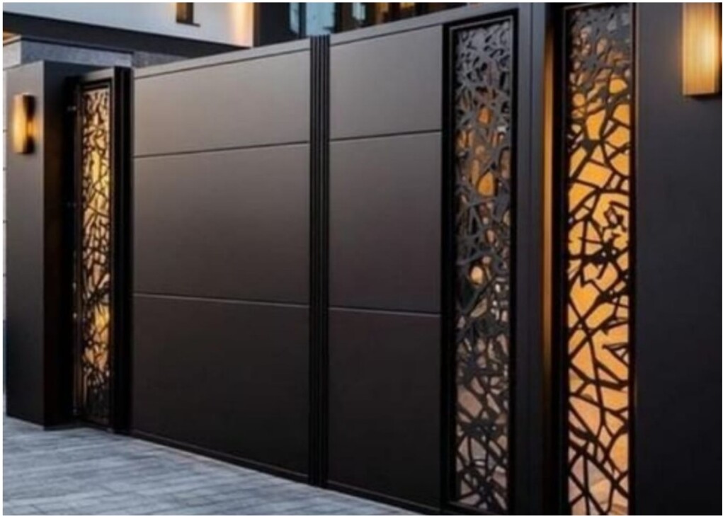 Close-up of dark metal gate with decorative panels